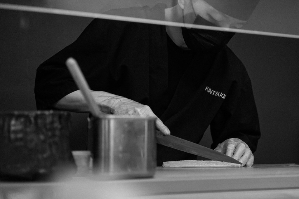 Chef at Kintsugi with a knife and pot