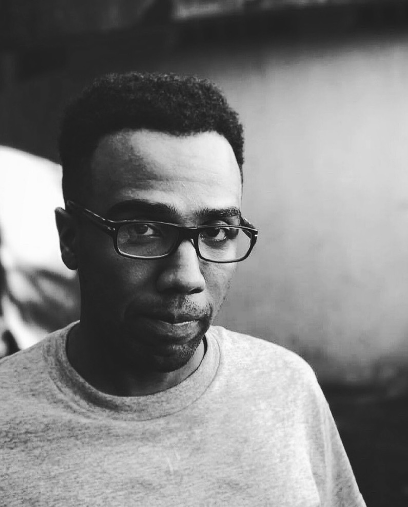 Black and white portrait of a man in glasses