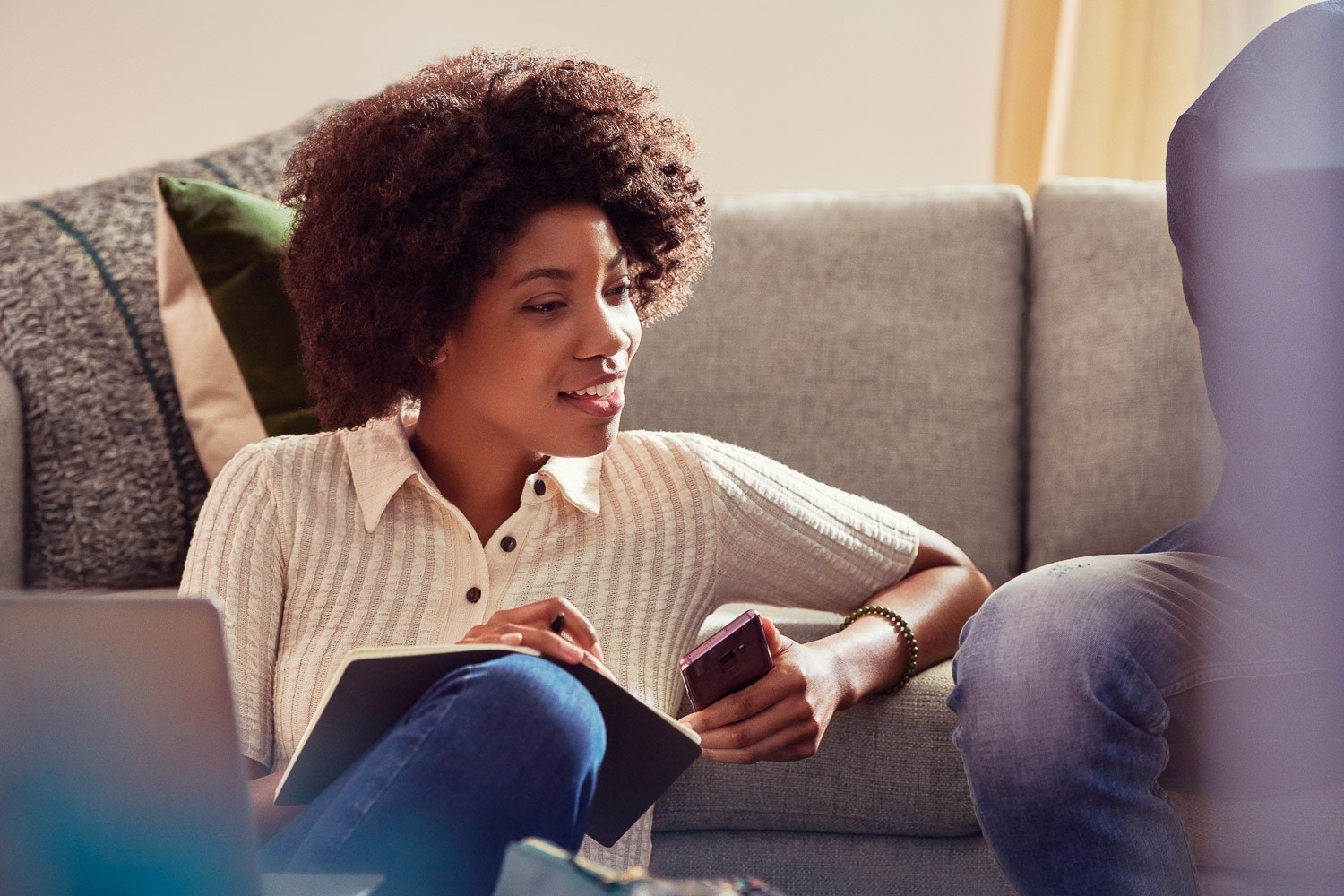 Lifestyle photograph, working from the sofa
